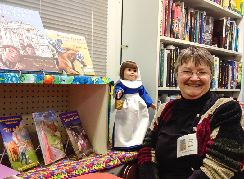 Rebecca with doll and books